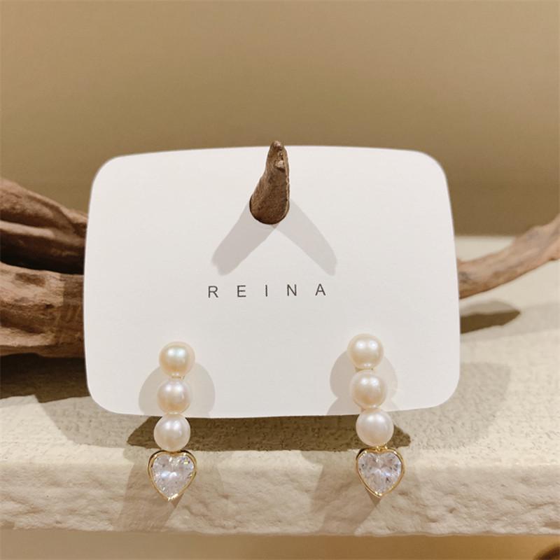 Korean Dongdaemun Pearl Heart Earrings: Unique Design, Light Luxury, Versatile Women's Accessory for Midsummer Temperament.