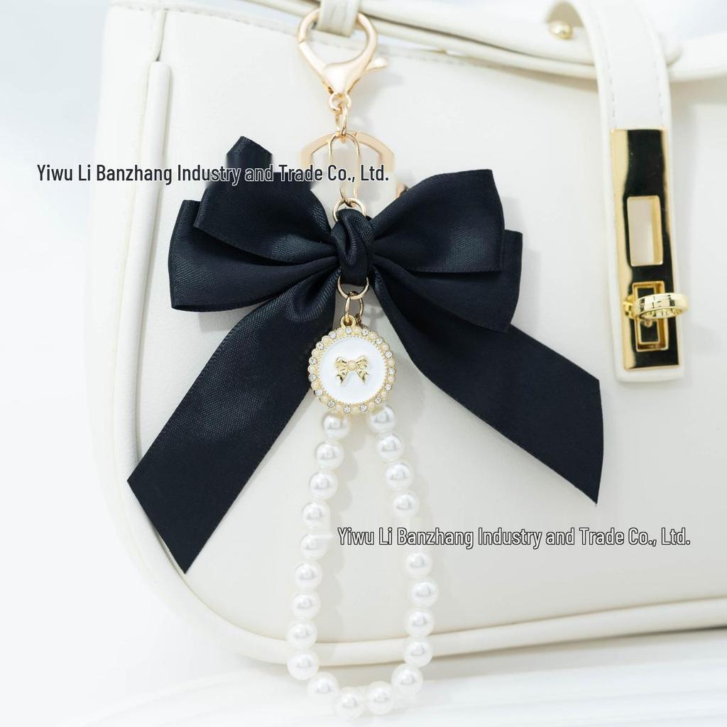 Large Bow Faux Pearl Bracelet Keychain with Colored Woven Strap and Alloy Tag Pendant