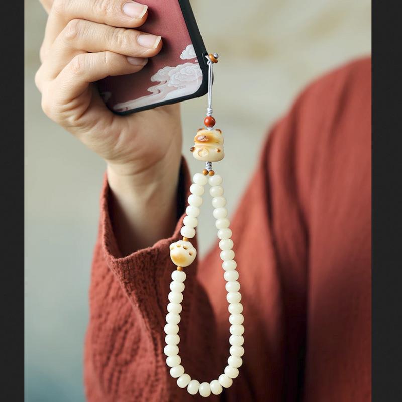 

Natural Bodhi Root Phone Strap with Cute Charcoal-Crafted Cat Paw Pendant, Creative Artistic Accessory for Women Mobile phone charm