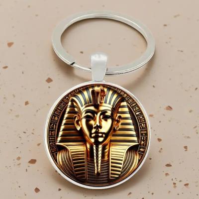 Módní egyptský faraon, Kleopatra a designový skleněný přívěsek na klíče