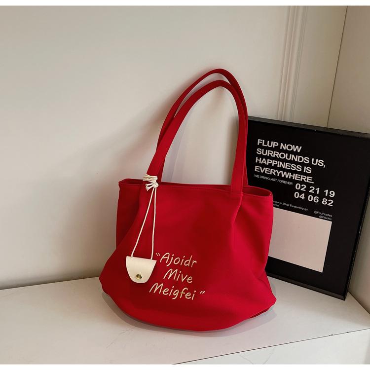 

Casual simple large-capacity bag women s 2025 new fashion versatile letter canvas bag commuter shoulder tote bag червоний