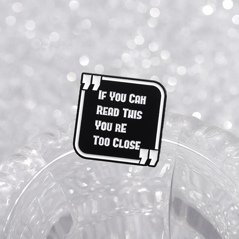 And Black Contemporary White Enamel Pin Brooch With Cartoon Design Perfect For Unisex Wear Casual