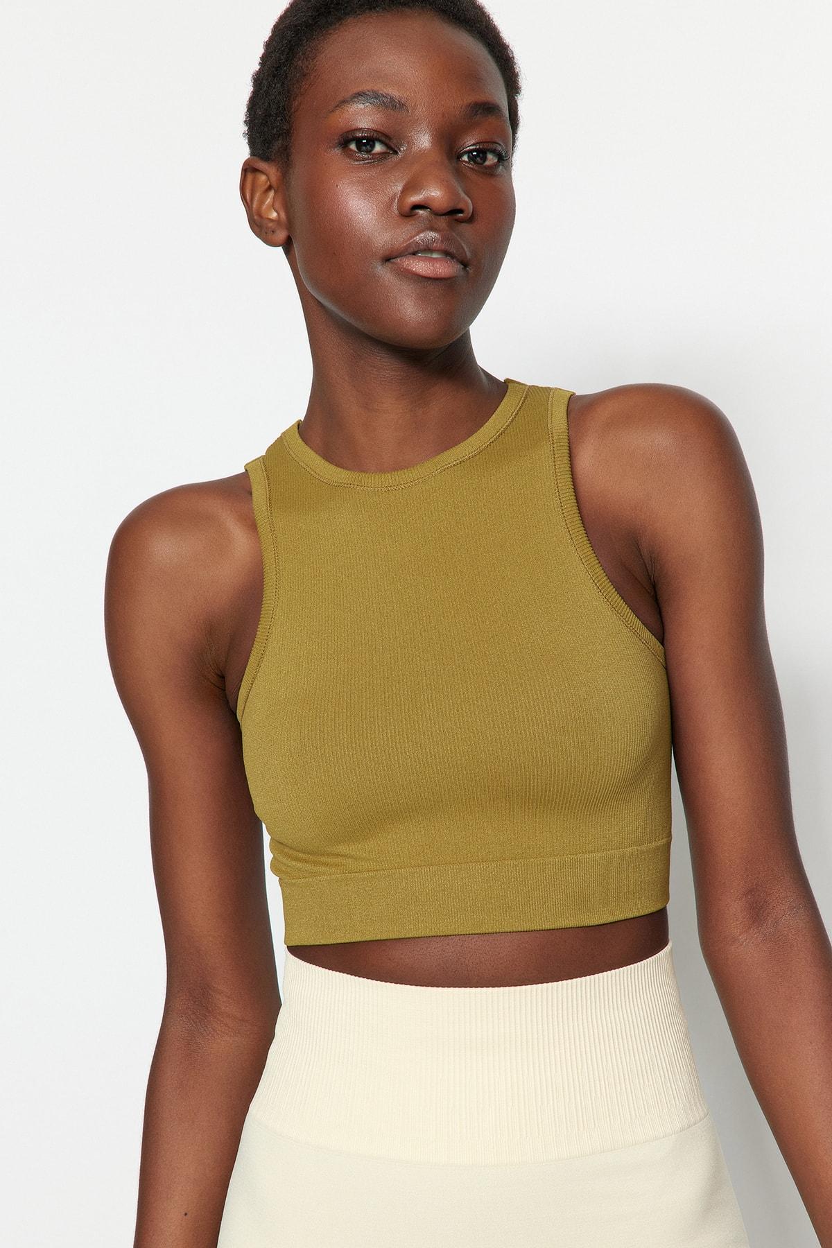 

Светло-зеленый вязаный спортивный бюстгальтер с низкой спинкой..