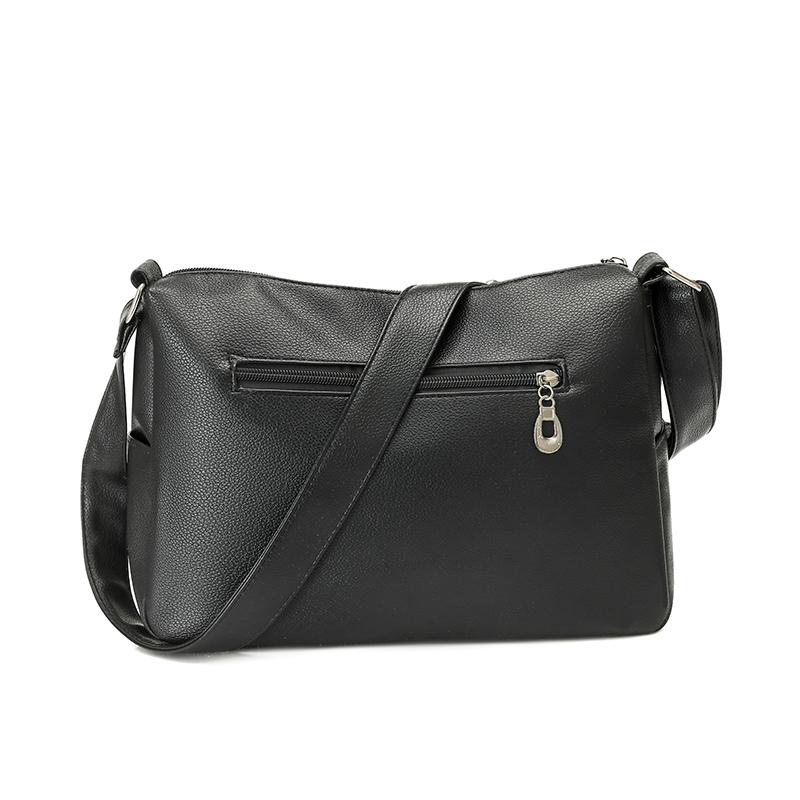 Einfarbige Damen Crossbody-Tasche mit geripptem Panel und Nieten-Details Elegante Kunstleder-Umhängetasche für den täglichen Gebrauch