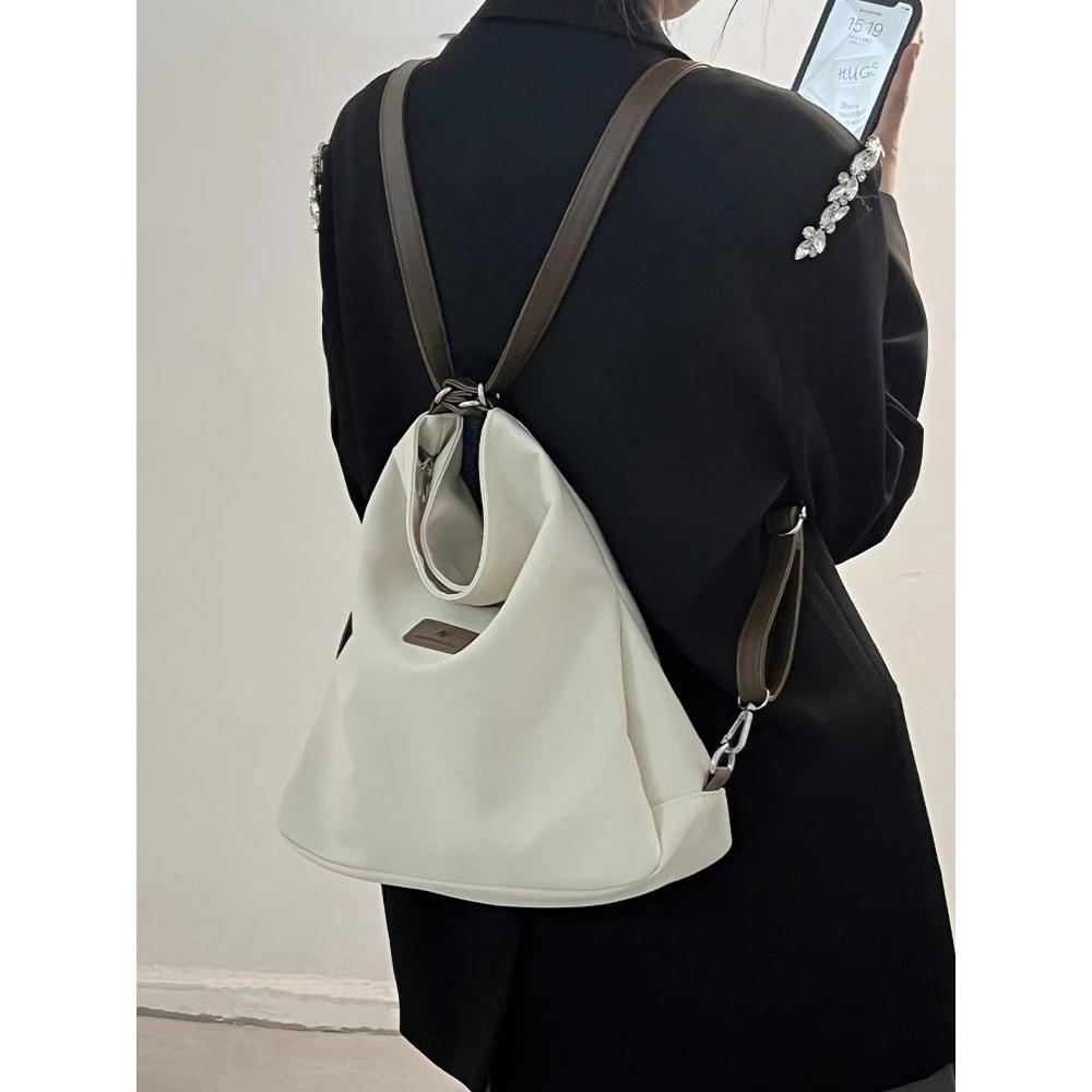 One pack of three-purpose backpacks 2025 new backpack schoolbag female college student canvas bag female shoulder messenger bag popular