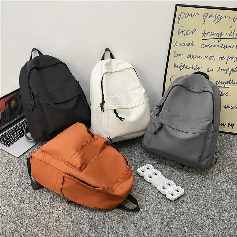 Simple and large-capacity unprinted backpack casual men's and women's same backpack junior high school solid color student schoolbag