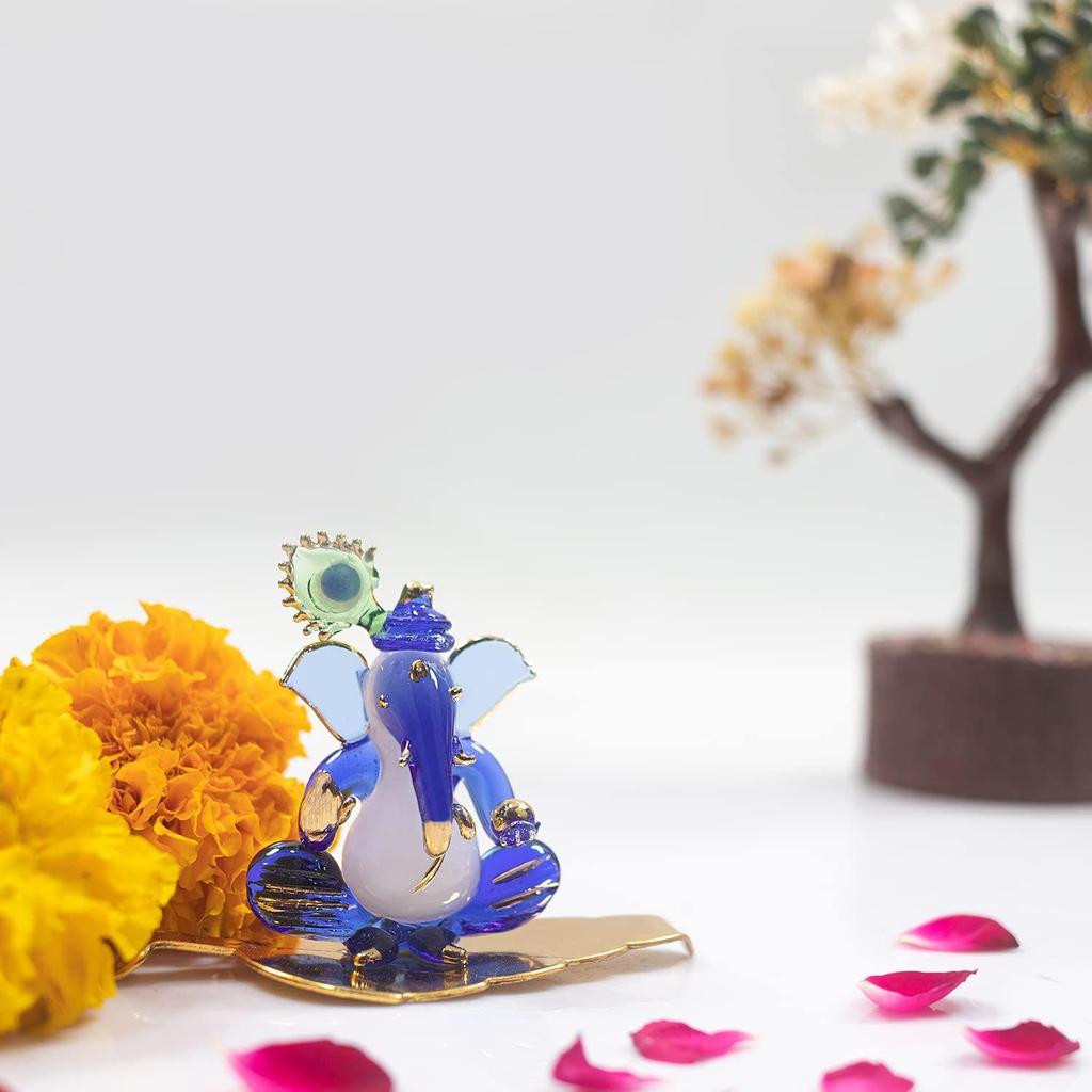 Ganesh Sitting with Leaf Statue (Murti) Idol Showpiece Handmade of Crystal Glass for Worship, Decoration, Car Dashboard, Gift