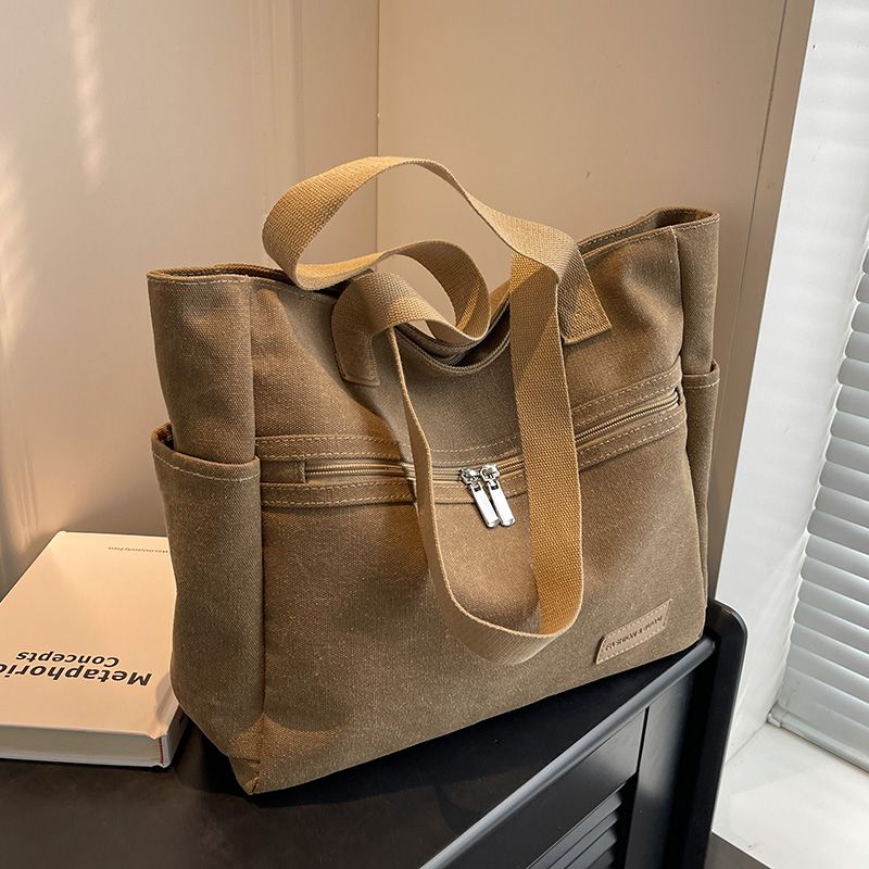 

Canvas Bag Women s Summer Large Capacity Bag 2025 New Arrival American Retro Commuter Hand-Carrying Bag Make-up Class Shoulder Tote Bag Kakh