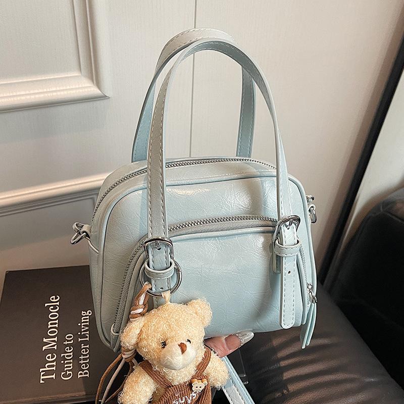 Spring and Summer New Korean Niche Ins Wind Oil Wax Leather Portable Pillow Bag Casual Versatile Commuter Wind Messenger Women's Bag