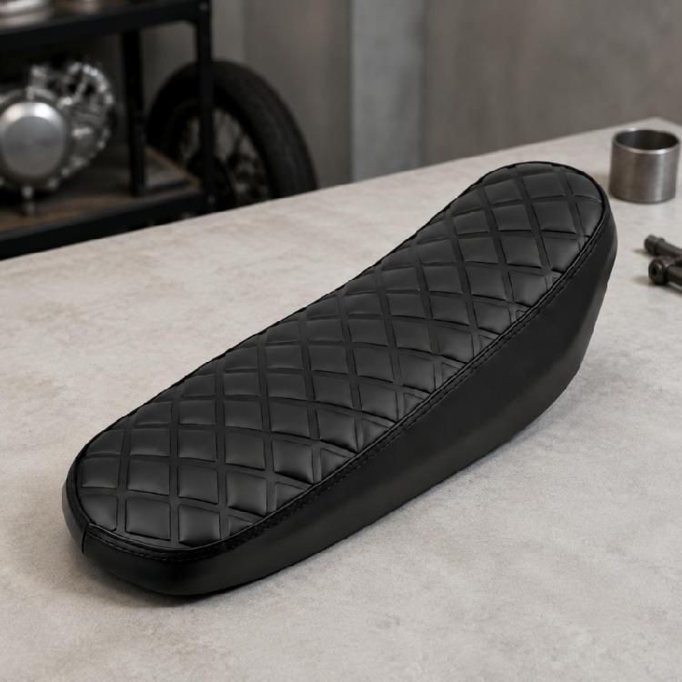 Worn Motorcycle Seat Cushion Replacement with Patterned Quilted Detail and Stitched Perimeter for X160 X260 Custom Bike Restoration