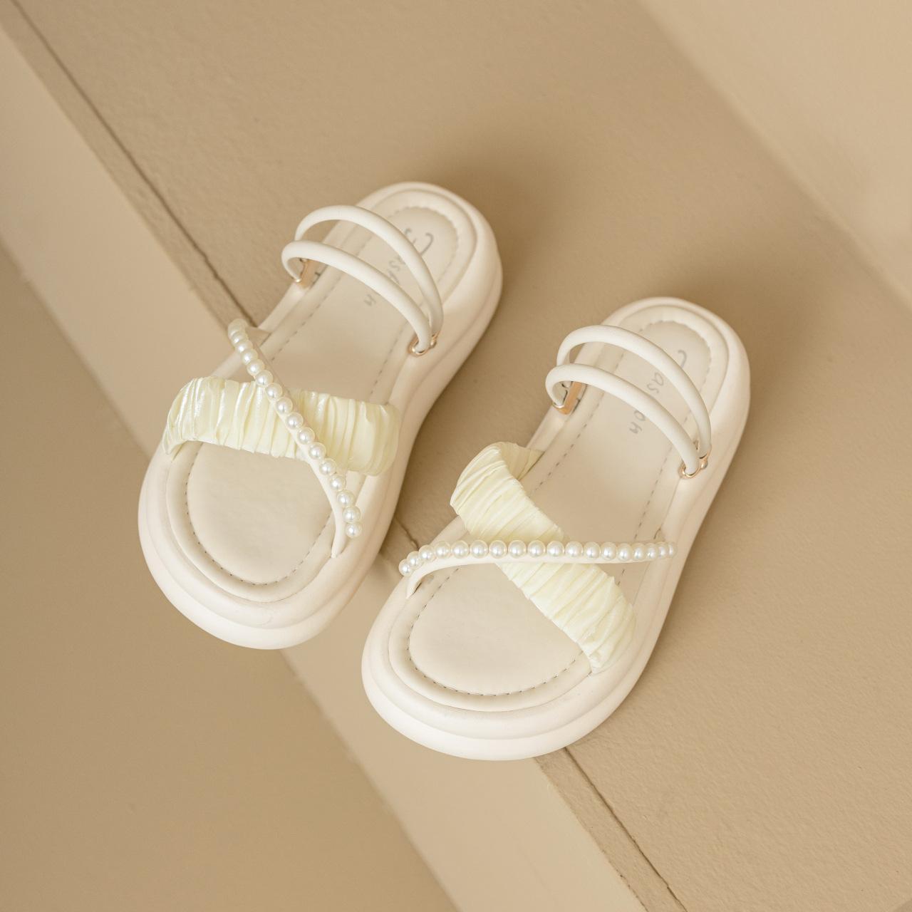 

Cross-strap pearl sandals women s new summer 2025 vacation style with skirt outside casual versatile beach shoes 40