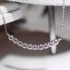 Curved smile pendant necklace, set with zircon stones