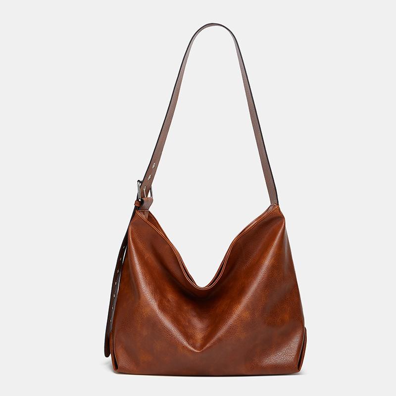 

Large capacity women s commuter armpit bag, new women s bag, retro solid color soft-faced tote bag, casual shoulder bag.