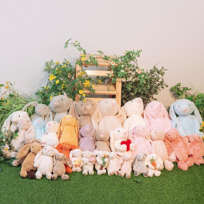 Floral Bunny Doll In White, Deep Pink, Light Pink, Brown, Grey, and Purple by Jellycat