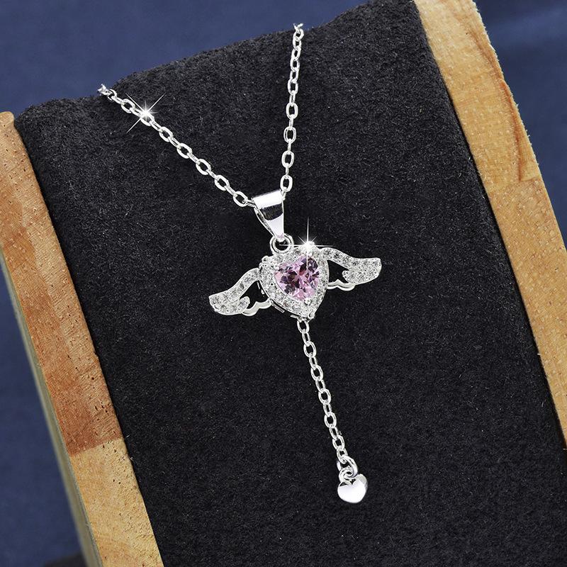 

Captivating Heart Necklace Adorned With Angel Wings And Sparkling Diamonds