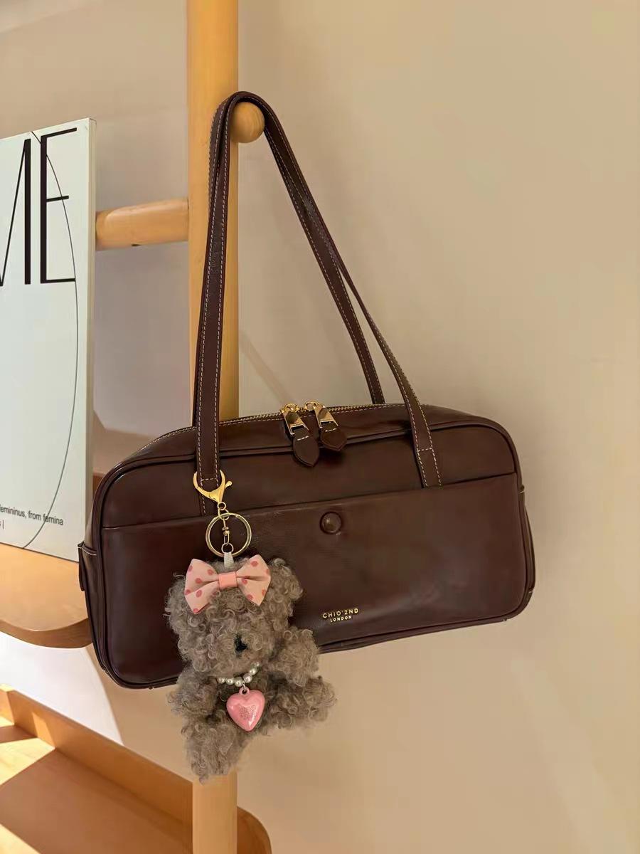 

Nanfeng Retro Trend Chestnut Sweet Dream Pillow Bag Women s 2025 New Retro Boston Commuter Shoulder Bag