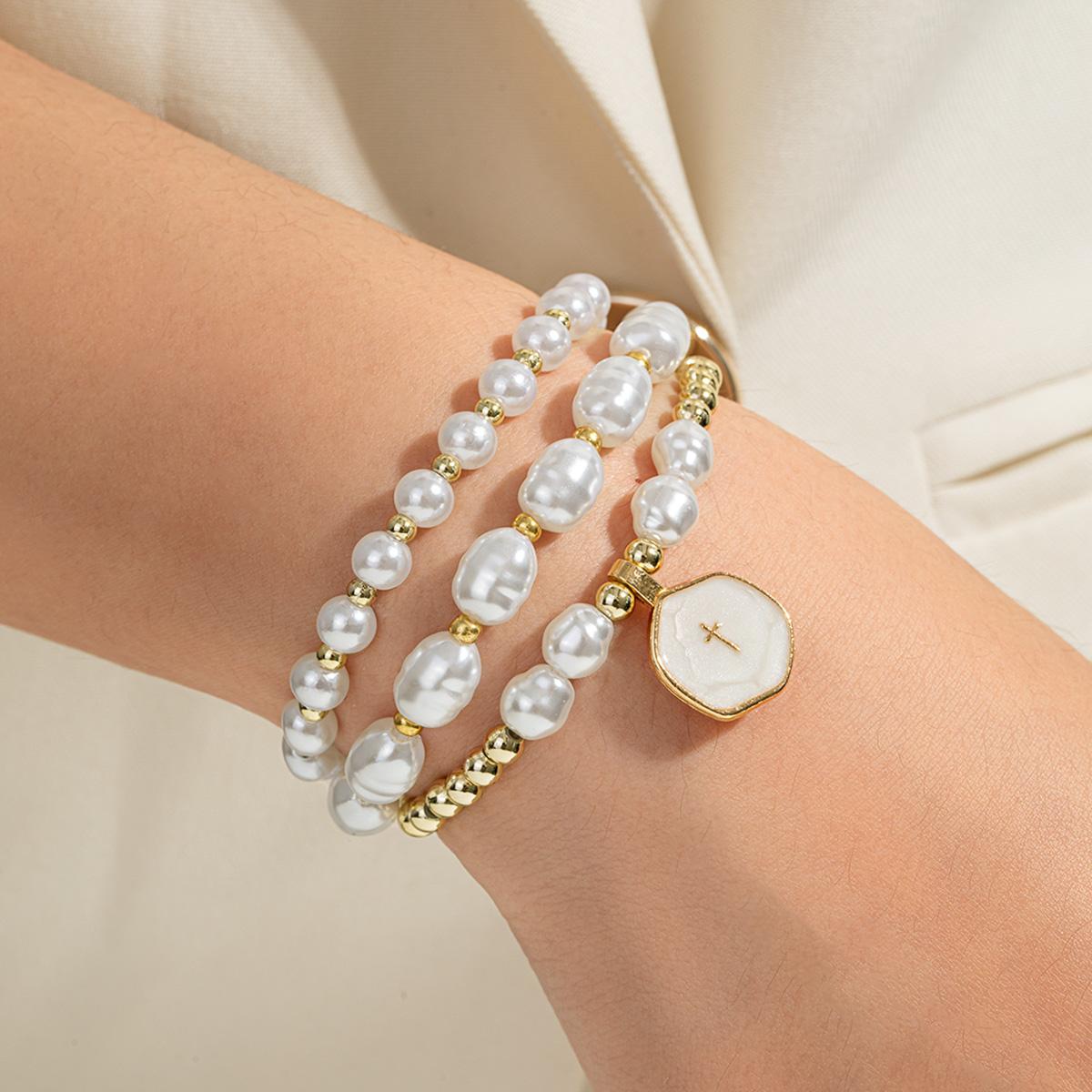 

Light luxury high-grade imitation pearl beaded bracelet, elegant and versatile three-layer stacked cross jewelry