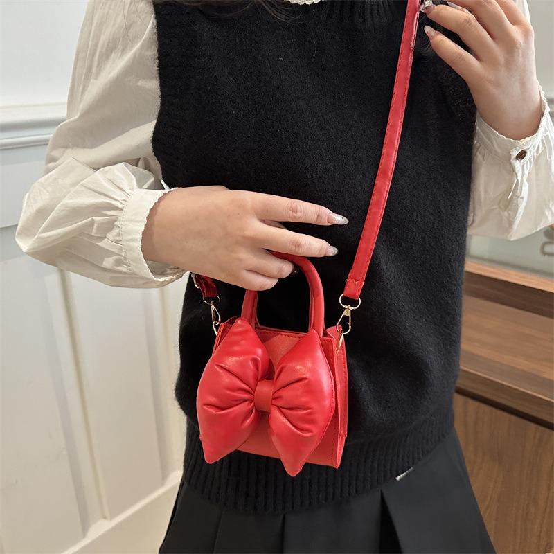 Niche bow solid color new mini hand carry small square bag summer beautiful retro shoulder messenger bag women