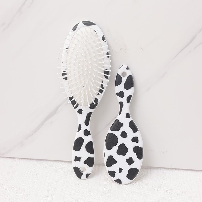 

Cute Dual-Use Hair Brush: Straighten, Curl & Smooth with Cartoon Cow Design - Portable Oval Air Cushion Massage.