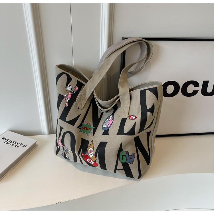 Canvas bag Women's large-capacity printed alphabet portable shoulder commuter tote bag Fashion new