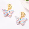 European and American Fresh, Sweet and Elegant Ceramic Butterfly Coral Earrings Temperament Pastoral Atmosphere Women's Earrings