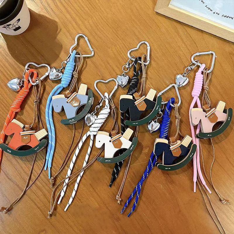 Creative leather rocking horse keychain cute trendy cool PU Trojan horse pendant men and women versatile bag hanging accessories small gifts