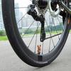 Tappi valvola luminosi a forma di osso e set di accessori per bicicletta