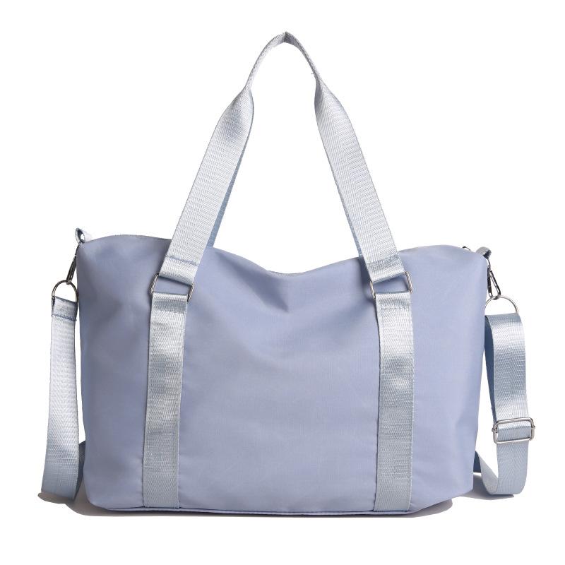 

Textured retro large-capacity shoulder bag women s new casual versatile commuter handheld underarm bag tide синій
