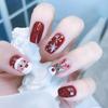 Playful Winter Glitter Nail Tips: Reindeer & Snowflake Design