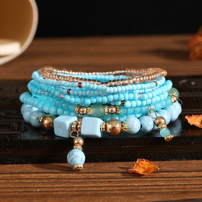 Böhmisches mehrlagiges elastisches Armband-Set: 8 Stränge kreativer Reiskornschmuck