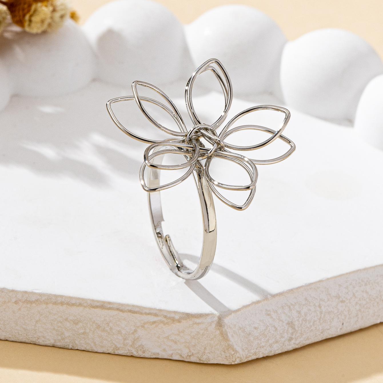 

A Women s Open Ring, Simple Iron Flower Design, Suitable for Everyday Wear and Vacations серебряный