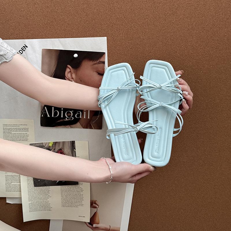 Stylish and simple versatile strap bow with open-toed cool slippers women's 2025 summer new flat-bottomed slippers