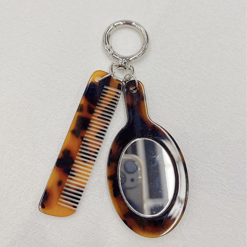 Neuankömmling Kreativer Harz-Kamm Schlüsselanhänger Essigsäure Spiegel Kammform Anhänger Schlüsselring Frauen Täglicher Gebrauch von Taschenzubehör