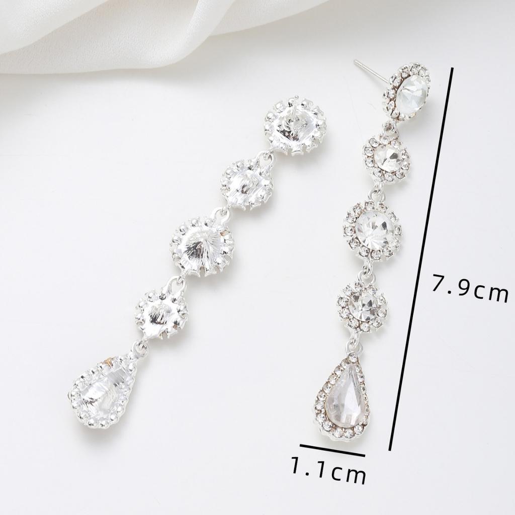 Neue amerikanische Retro-Ohrringe vielseitige lange Ohrringe mit Fransen besetzt mit weißem Kristall Wassertropfen Ohrstecker weiblich Ins vielseitig