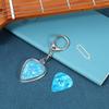 1pc Guitar Pick Holder Keychain - Heart-Shaped with Secure Lid, Durable Acrylic Guitar Pick Organizer for Musicians, Musicians