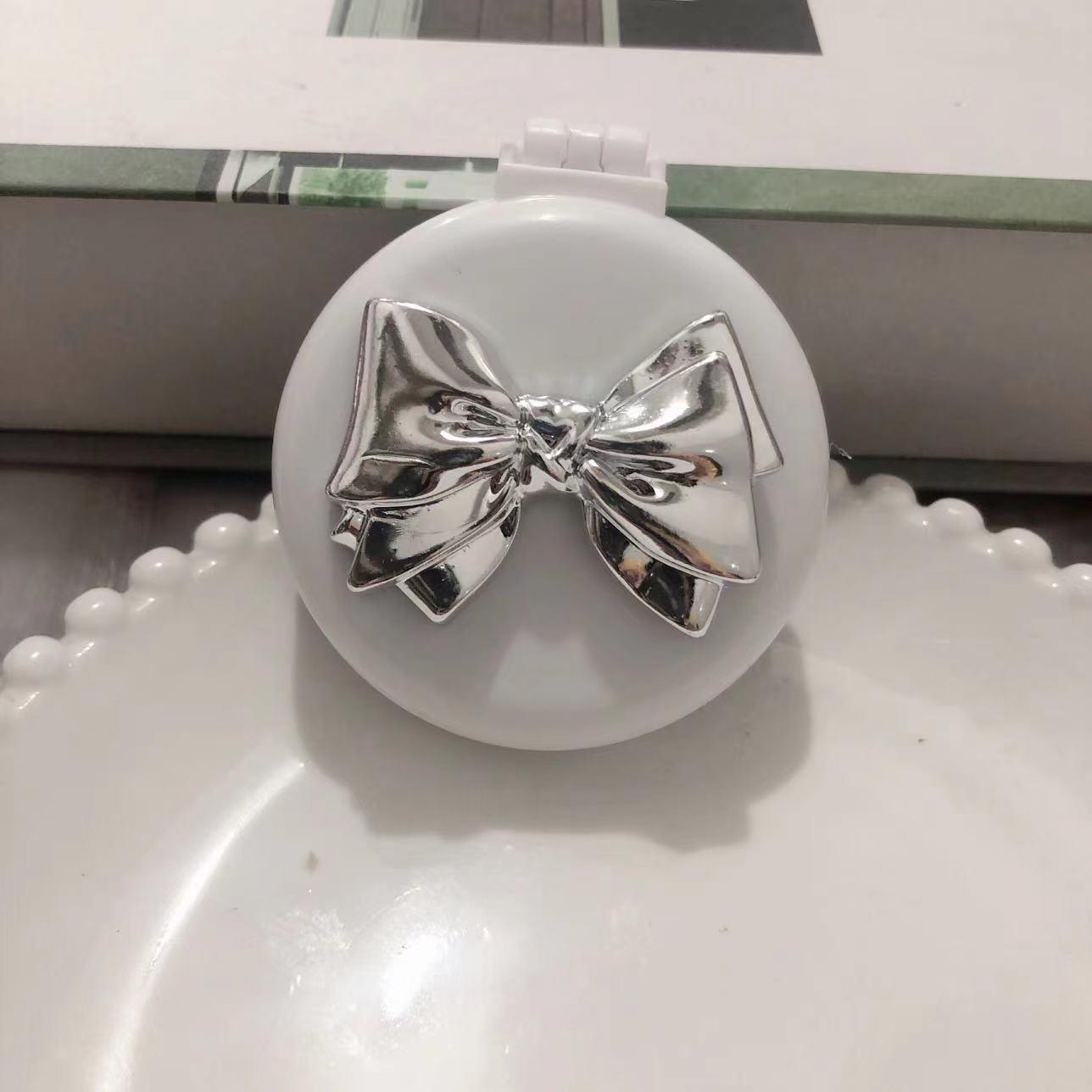 

Милая складная расческа-бантик с воздушной подушкой и зеркалом