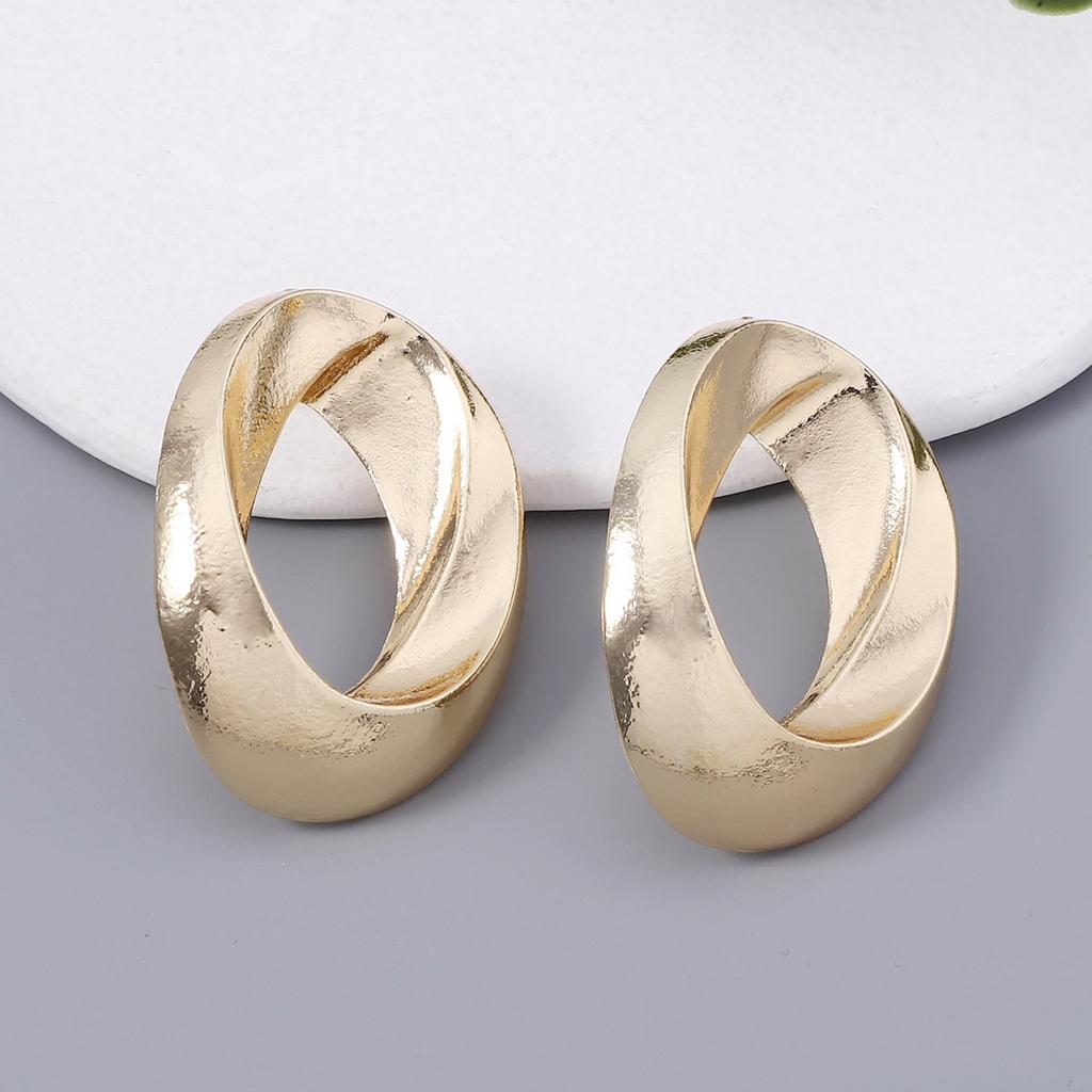 Geometric Circular Hollowed-out Elliptical Metal-textured Earrings for Both Men and Women, with a Cold and Simple Style for Couples