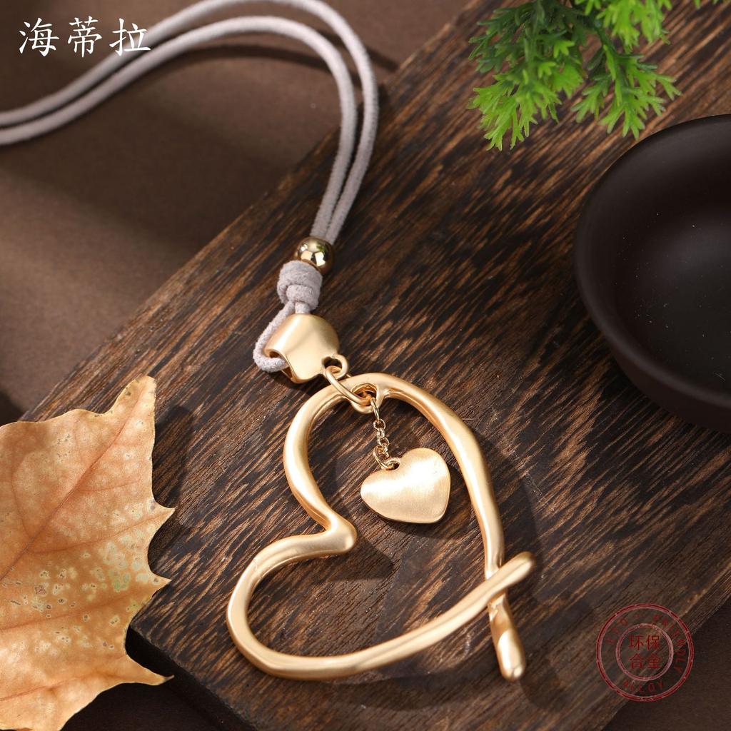 New brushed matte hollow love leather rope long pendant women's versatile heart-shaped velvet long necklace