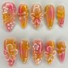 24 Stück Glänzende Aufklebenägel Mittlere Länge Mandelform, Florales Farbverlaufsdesign, Rosa & Goldene Glitzerakzente, Wiederverwendbare Künstliche Nägel für Hände & Füße