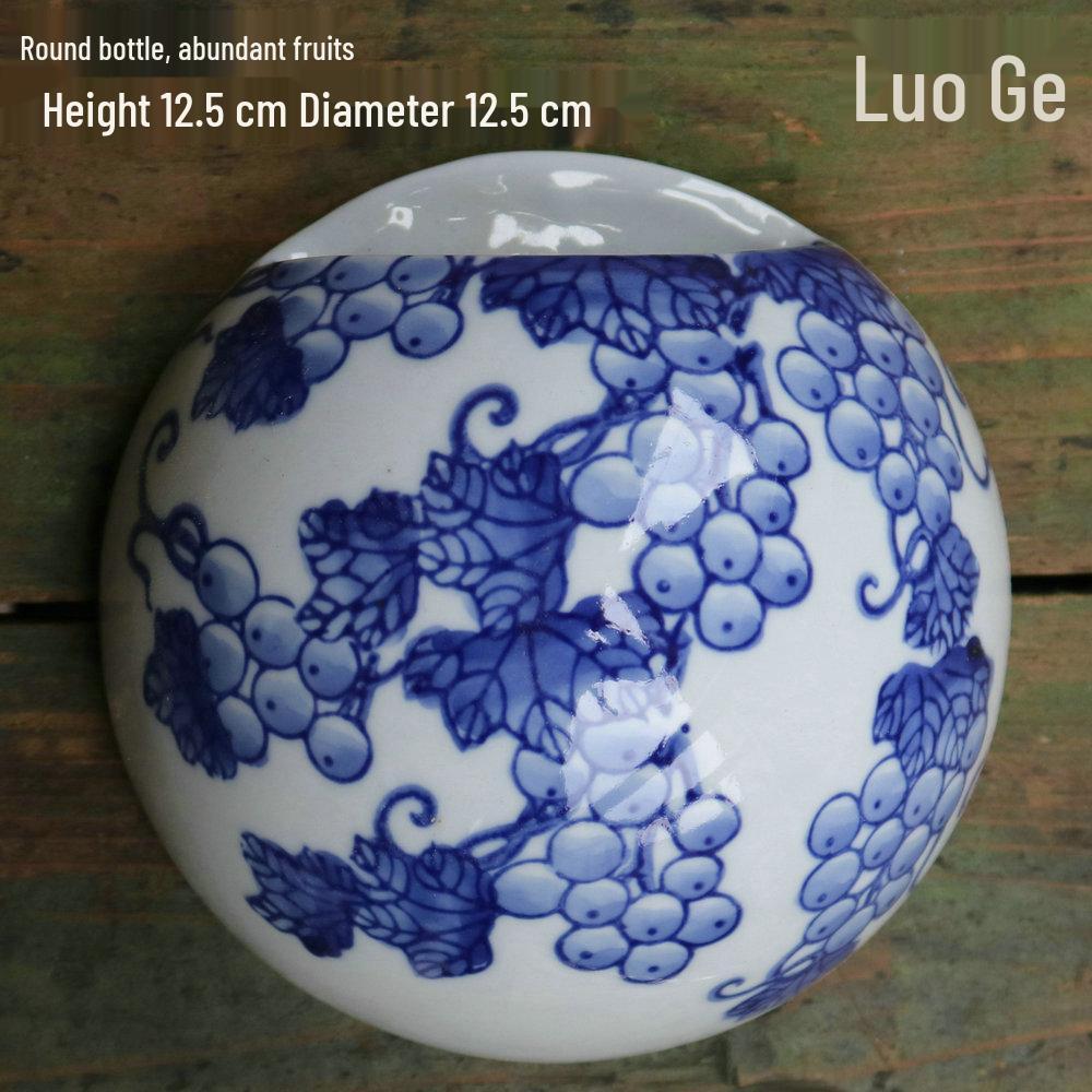 Hand-Painted Blue and White Ceramic Wall Vase with Floral and Bird Design