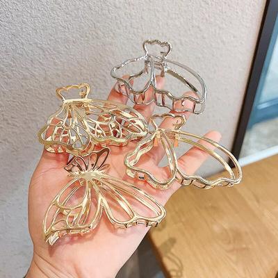 Fermagli per capelli a farfalla alla moda Fermagli per capelli a farfalla dorati/argentati in lega di zinco cava Accessori per capelli da donna