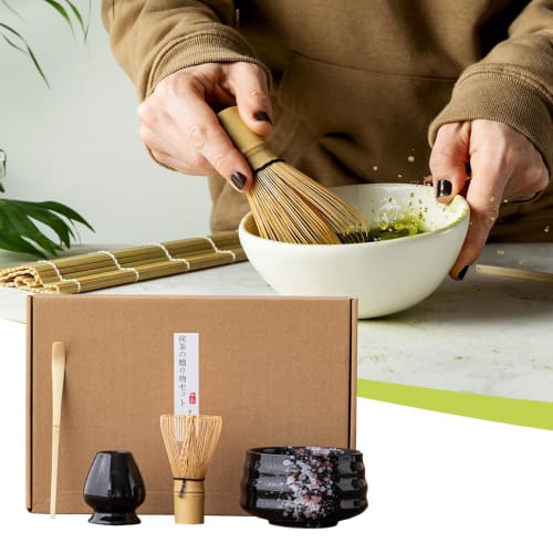 This 4-piece tea ceremony set includes a tea whisk, a 100-piece tea whisk holder, a straightening tool, a tea scoop, and a matcha bowl. It's compact a