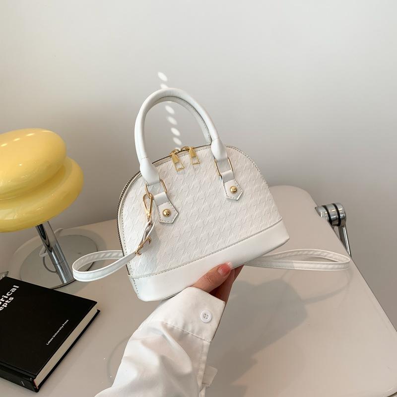 

Женская простая сумка 2024 года, осень, новый иностранный стиль, однотонная сумка через плечо, корейская версия, модная темпераментная сумка-ракушка белый