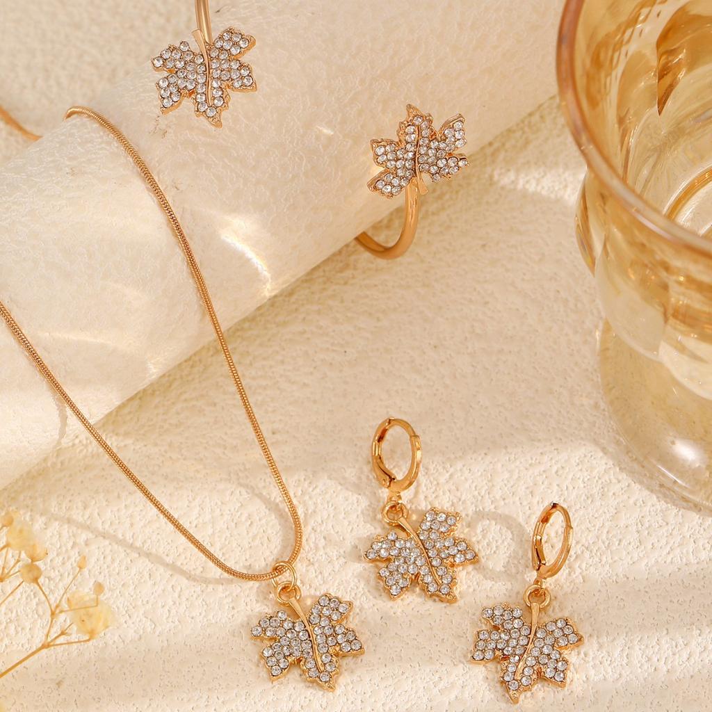 2025 New popular zircon maple leaf pendant set jewelry women's simple and elegant cold wind necklace stud earrings jewelry