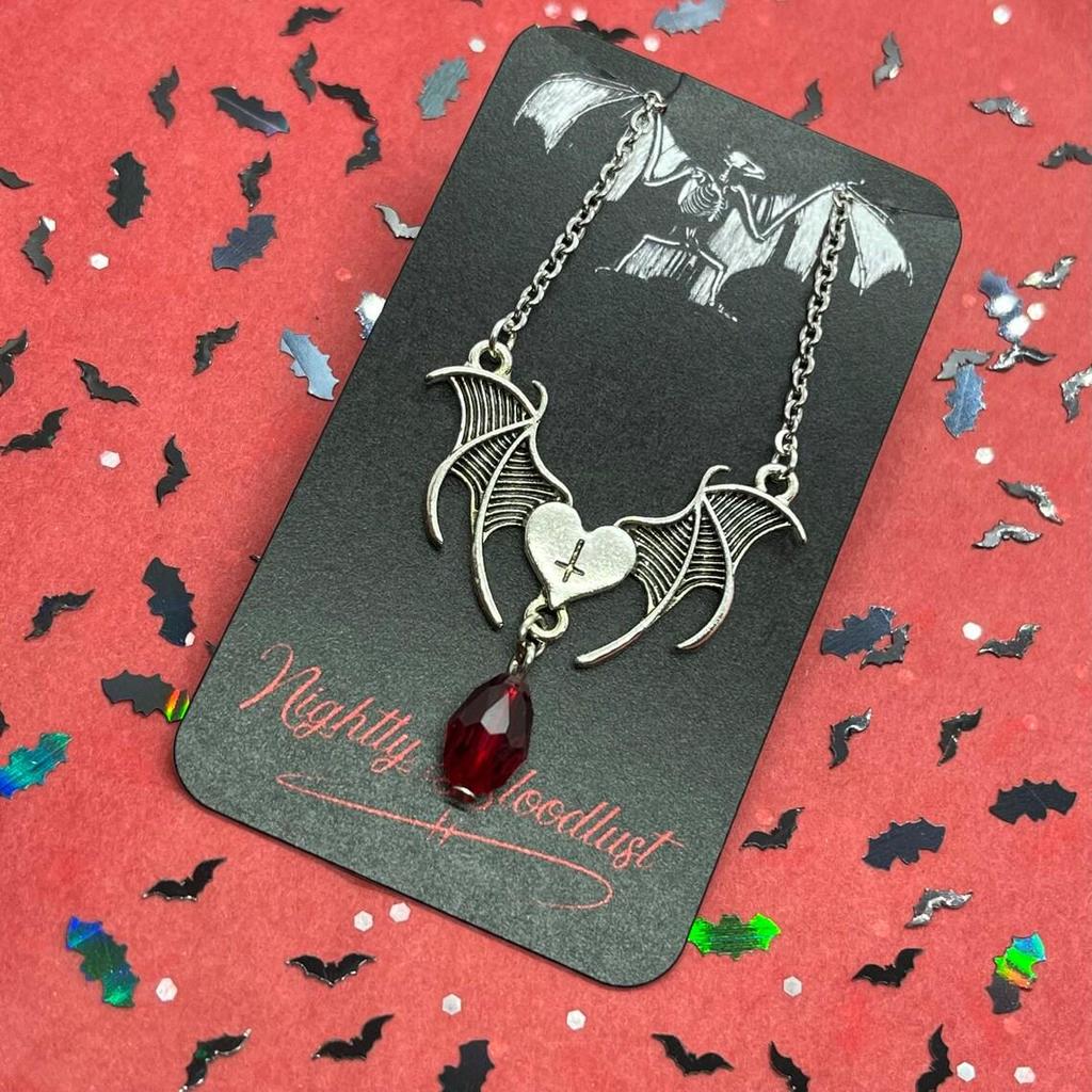 Gothic Bat Wings Necklace with Heart, Cross, and Red Glass Accents