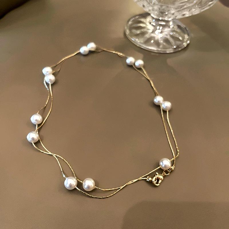 

Korean Double-Layer Pearl Clavicle Choker: 2023 High-End Personalized Design Necklace for Women