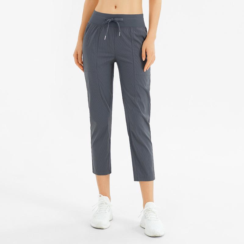 Women's Quick-Dry Yoga Pants: Breathable, Loose-Fit, Nine-Point Length with Drawstring for Running and Fitness.