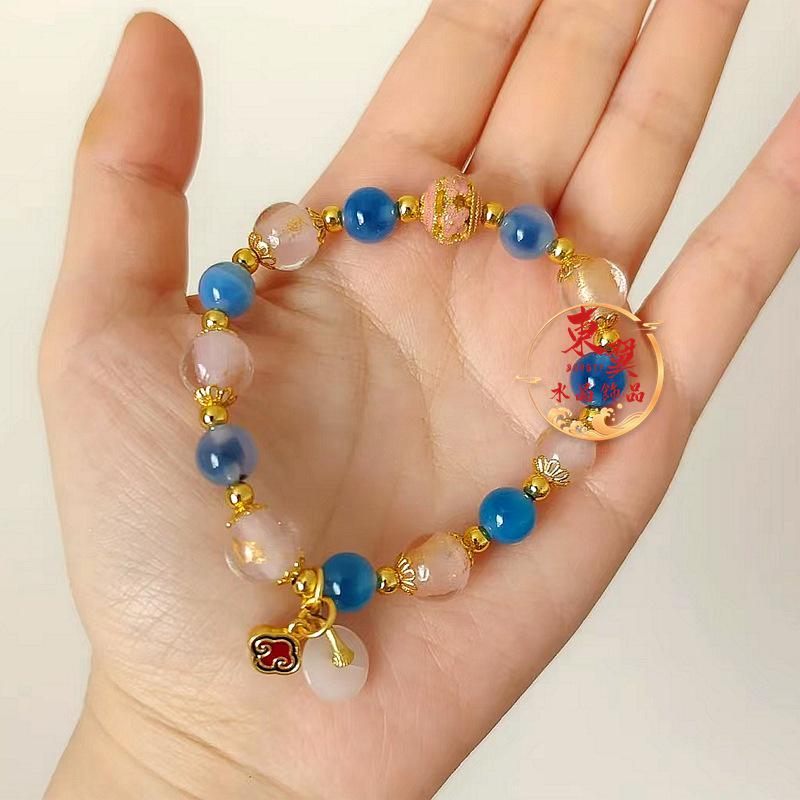 Women s Bracelet: Blue Agate Heart, Gold Foil, Ping An Kou Flower, Porcelain Glaze, Half Sugar Design.