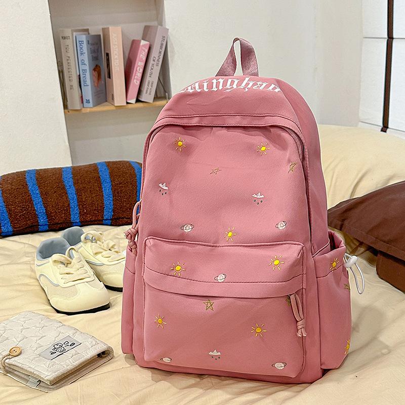Design sense dopamine embroidery large capacity junior high school bag ins niche female high school student lightweight backpack