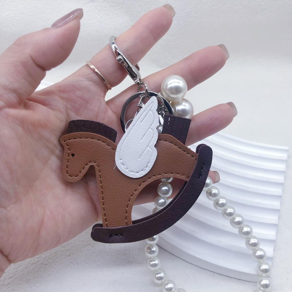 Year of the Horse small pendant keychain bag pendant three-dimensional PU rocking horse pendant holiday small gift car pendant pendant